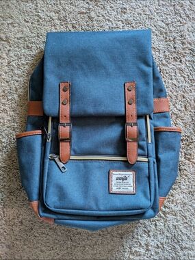 Classic Blue Canvas Backpack with Brown Accents